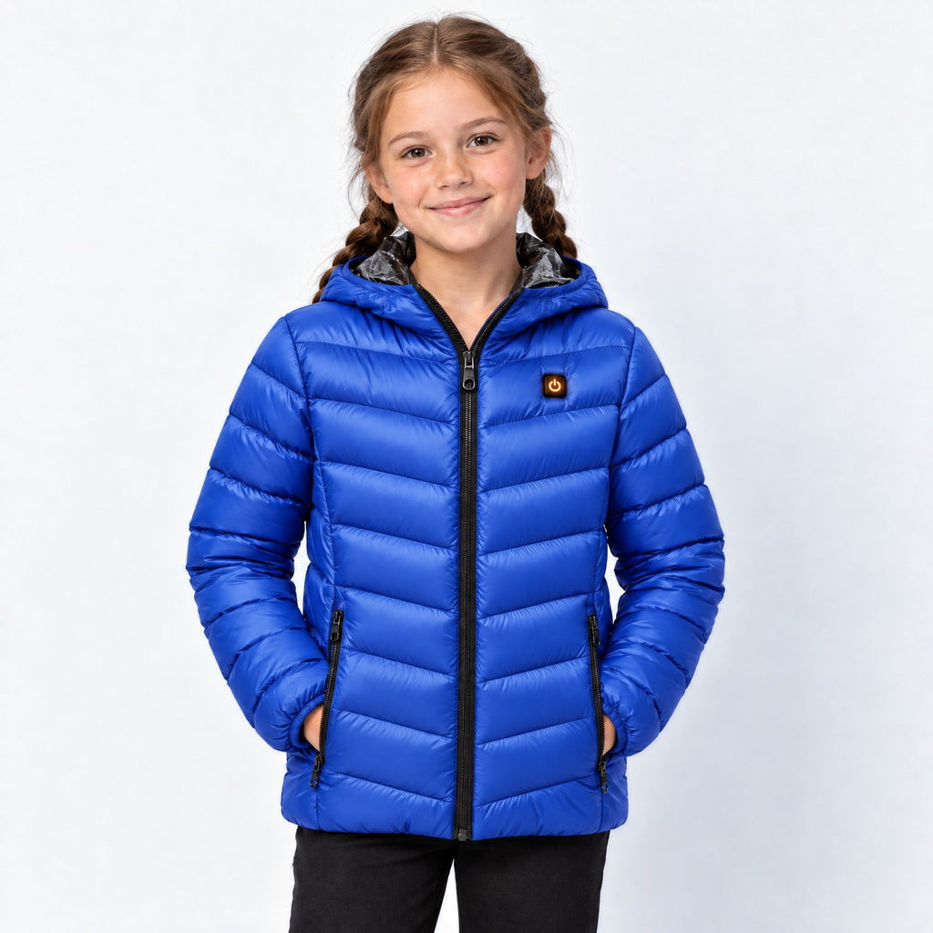 Doudoune chauffante enfant Alpine bleu marine portée par une fille, photo studio sur fond clair